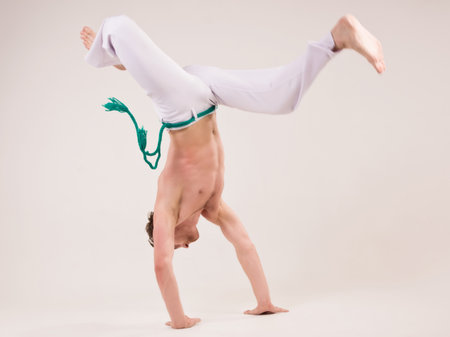 Capoeira guy making a coupの写真素材