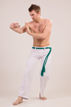 Capoeira dancer on white backgroundの写真素材