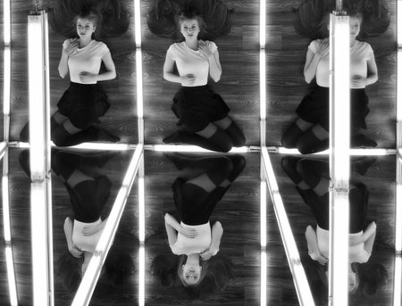 beautiful sexy girl and her reflection in mirror table
