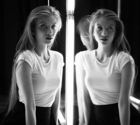beautiful sexy girl and her reflection in mirror table