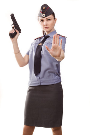 Woman police officer with gunの写真素材