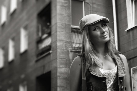 Beautiful young woman walking on the street. Black and white imageの写真素材