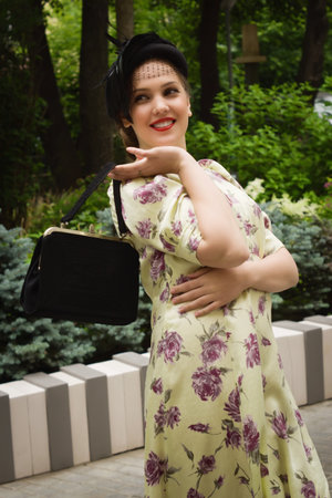 Very beautiful soviet girl in retro style is on the Moscow streetの写真素材