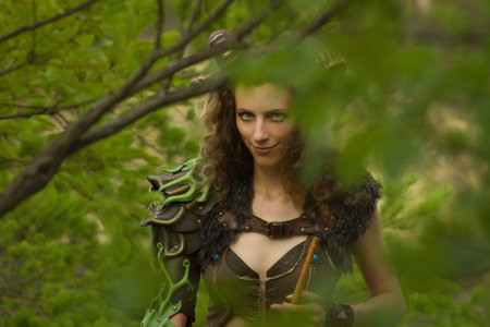Pretty female faun in a wood. Mythological creature in a forestの写真素材