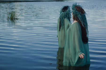 Two mermaids on the forest lake