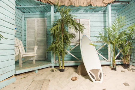 Summertime. Sandy beach. Palm bungalows on white sand beach.の写真素材