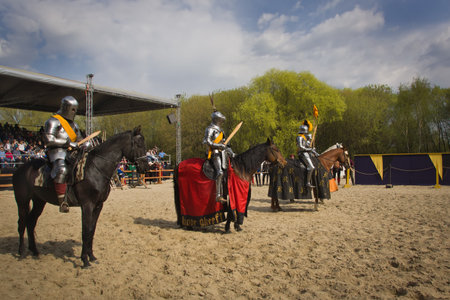 The horse knights in an armour and in a helmet with a sword in a hand. St.George knightly tournament. Moscow on May 1, 2016のeditorial素材