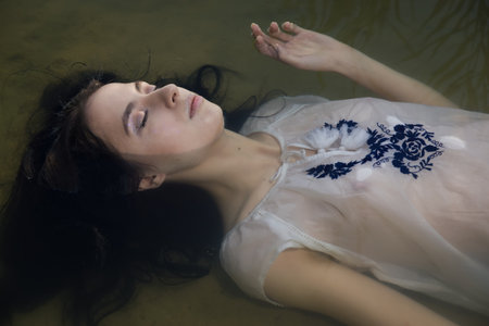 Young drown woman in a poetic representation.の写真素材