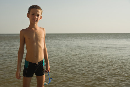 Portrait of young boy kid child at sea. Summer holidays vacationの写真素材