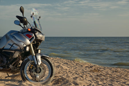 Motorcycle on a sea beach. Adventure concept