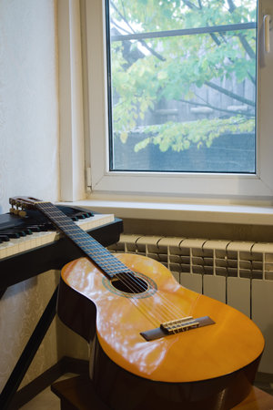 Acoustic guitar and keyboard at studioの写真素材