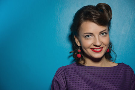 Closeup young woman pretty pinup girl retro vintage 50's styleの写真素材