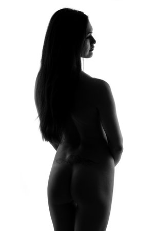 Beautiful topless pretty girl posing over whiteの写真素材