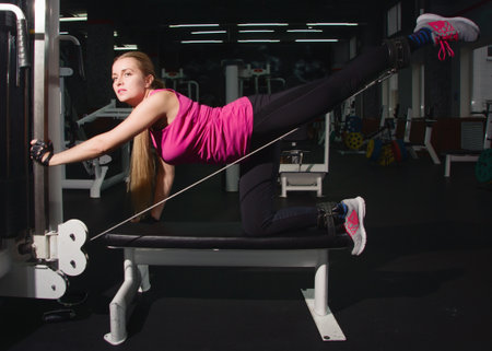 Beautiful Fit female training in a gym