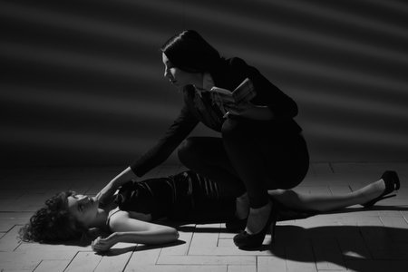 Film noir. Detective woman investigating the crime sceneの写真素材