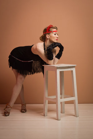 Gorgeous vintage 1920s lady in a black dress with headband