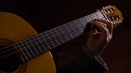 Guitarist Hand Playing. Motion blur. Extreme close-up