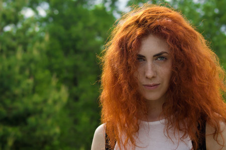 Close up portrait of a beautiful girl with long red hair