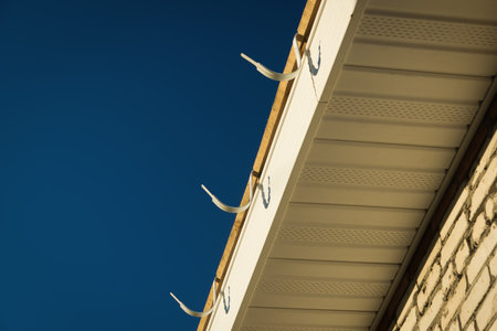 Construction of the roof of the house. Siding