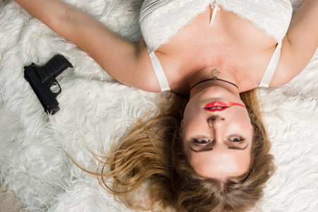 Crime scene simulation: lifeless woman lying on the floorの写真素材