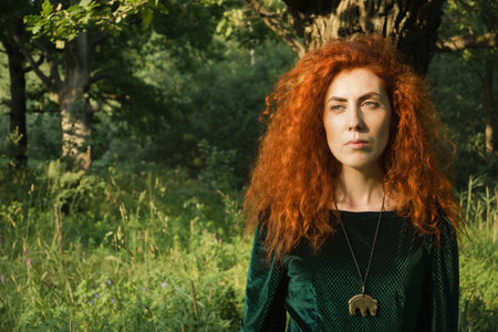 Close up portrait of a beautiful girl with long red hairの写真素材