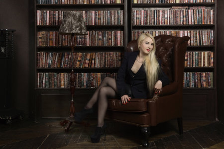 Confident business woman in the classical library roomの写真素材