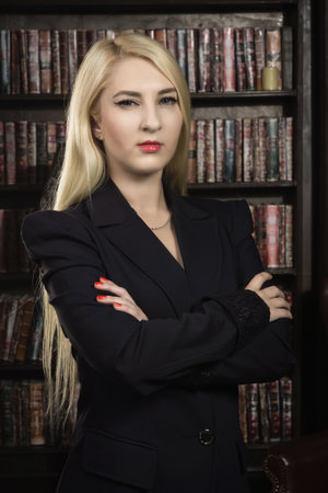 Confident business woman in the classical library roomの写真素材
