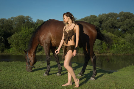 Wild amazon girl on horseback. Fantasy conseptの写真素材