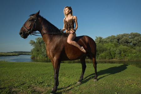 Wild amazon girl on horseback. Fantasy conseptの写真素材
