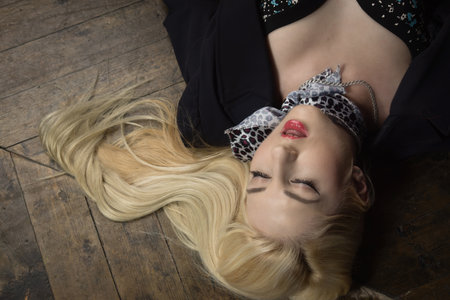 Crime scene (imitation). Strangled business woman in the classical library roomの写真素材