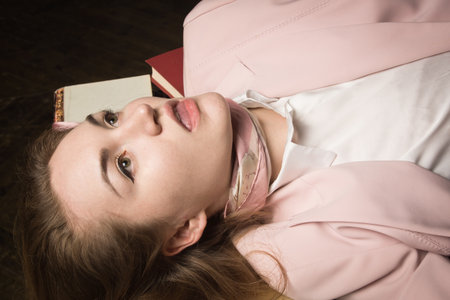 Crime scene (imitation). Strangled student in the classical library roomの写真素材