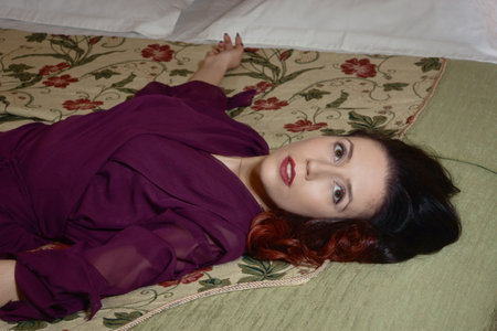 Noir film. Sexual woman being strangled in a vintage interiorの写真素材