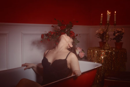 Beautiful sexy woman in a red bathroom. Spa body care.
の写真素材