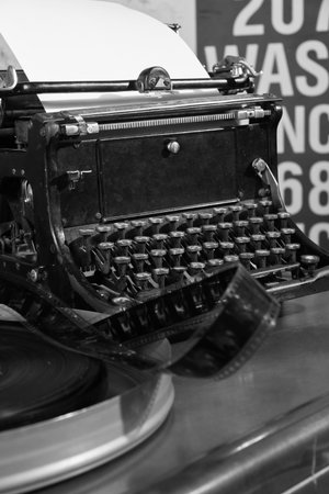 An old typewriter and a coil with a film.の写真素材