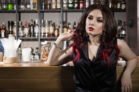 A Beautiful fashionable woman at a barの写真素材