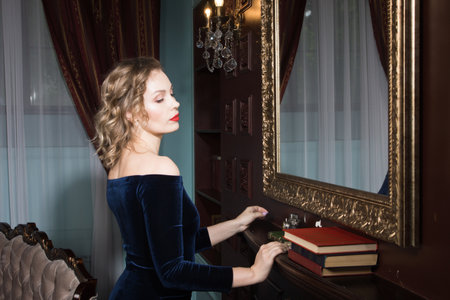Beautiful attractive woman in the vintage interiorの写真素材