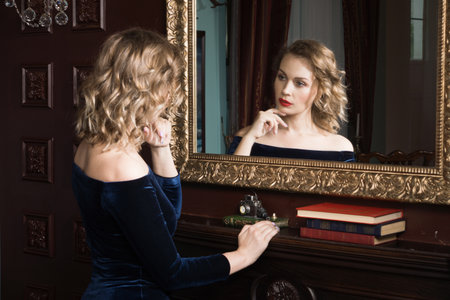 Beautiful attractive woman in the vintage interior
