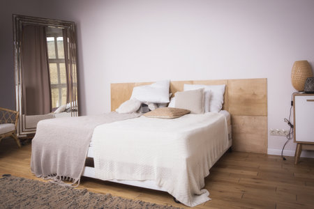 Interior of the beautiful bedroom with a vintage bed