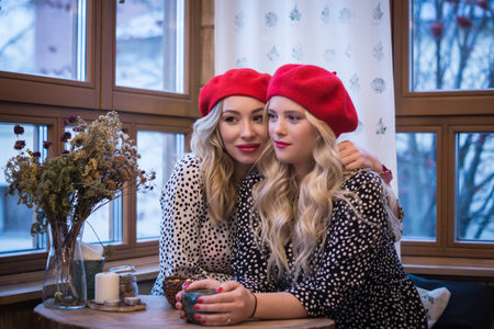 Girlfriens. Two beautiful fashionable women in retro style