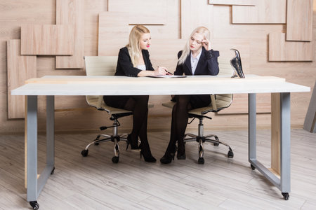 Two business women are negotiations. They argue.