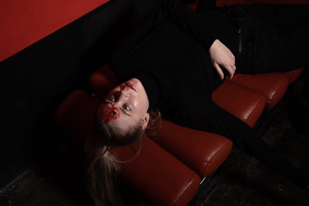 Hit woman. Woman in a black killed in gunfire shot in the headの写真素材