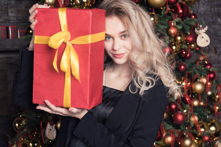 New Year Concept. Attractive pinup woman posing in a Christmas roomの写真素材