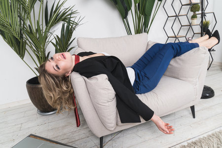 Crime scene with strangled pretty business woman in officeの写真素材