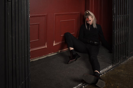 Hit woman. Woman in a black killed in gunfire shot in the headの写真素材