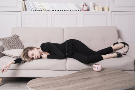 Lifeless beautiful woman in a room. Simulation of the crime scene.の写真素材