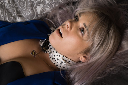 Noir film. Young beautiful flight attendant in uniform being strangled.の写真素材