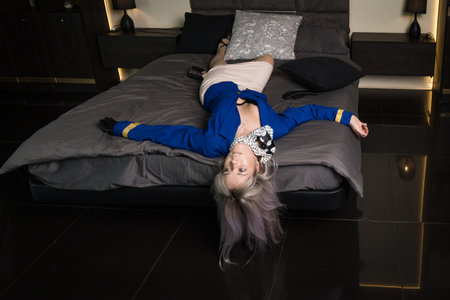 Noir film. Young beautiful flight attendant in uniform being strangled.の写真素材