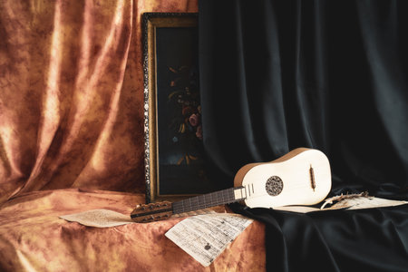 Musical still life in the Renaissance style with renaissance guitarの写真素材