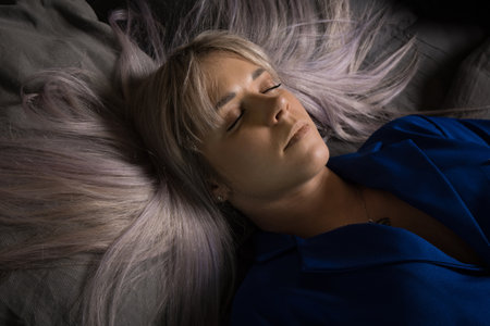 Noir film. Young beautiful flight attendant in uniform being strangled.の写真素材