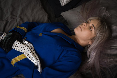 Noir film. Young beautiful flight attendant in uniform being strangled. Not contain any logos or trademark.の写真素材